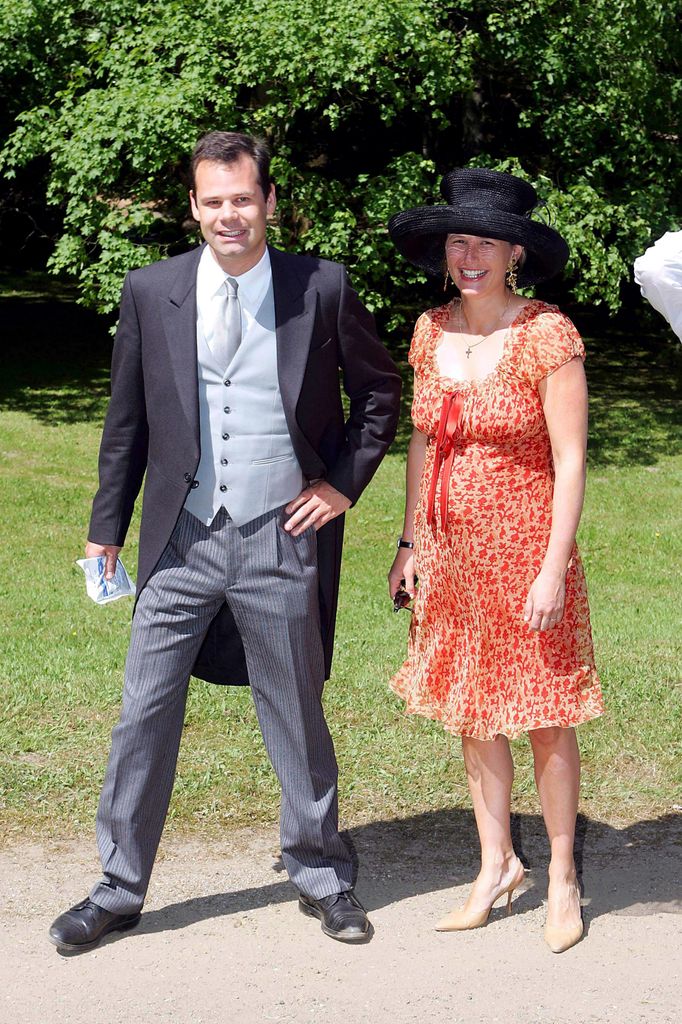 Prince Constantin with Pincess Marie in an orange dress