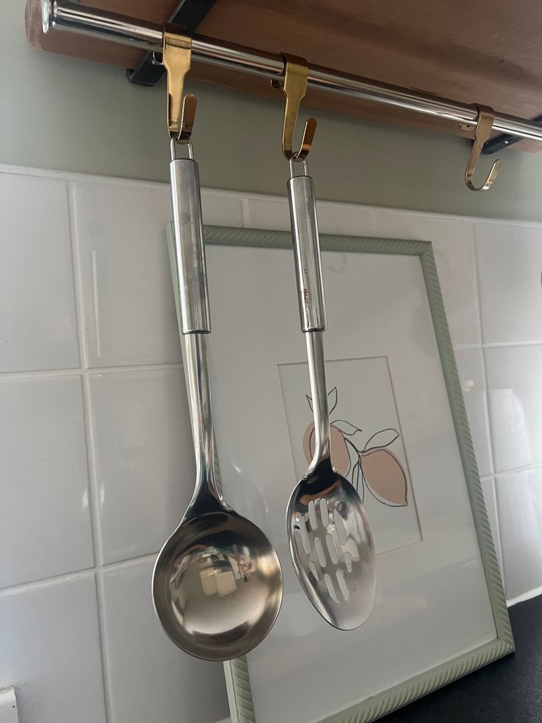 utensils hanging from rail