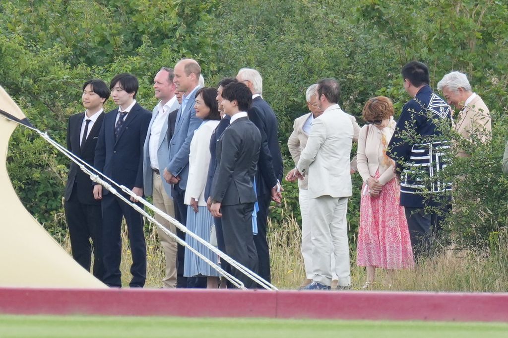 Prince William mingles with guests at polo