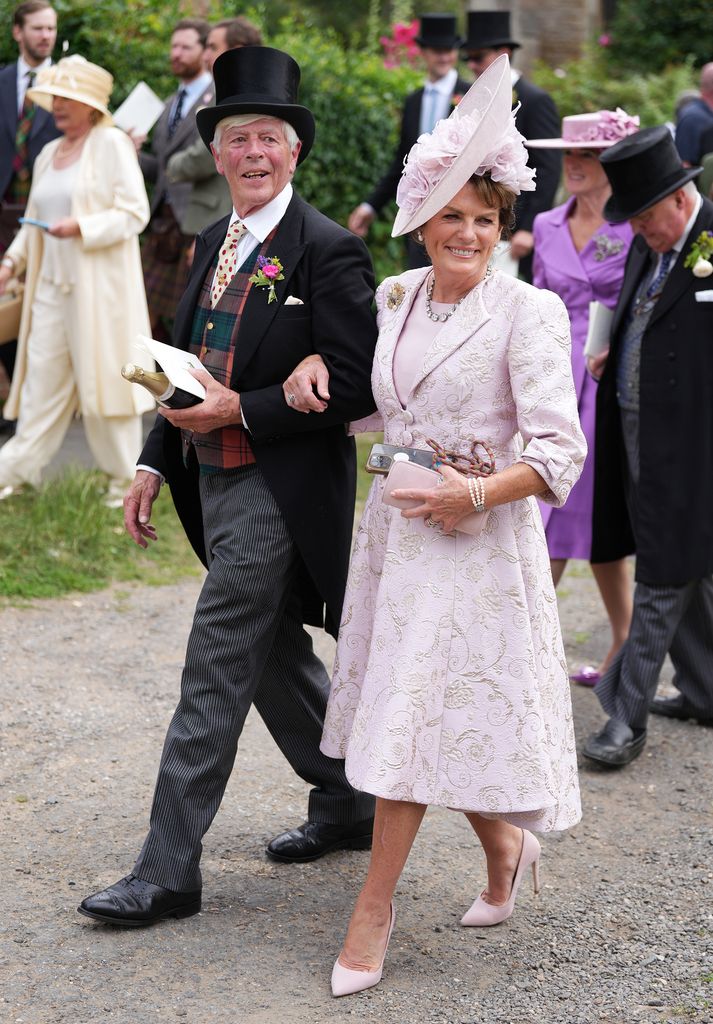 James Randolph Lindesay-Bethune, 16th Earl of Lindsay and Emma Manners, Duchess of Rutland smile in formal dress