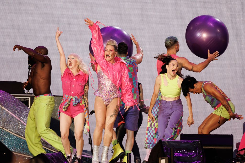 Pink in leotard and pink jacket performing at BST