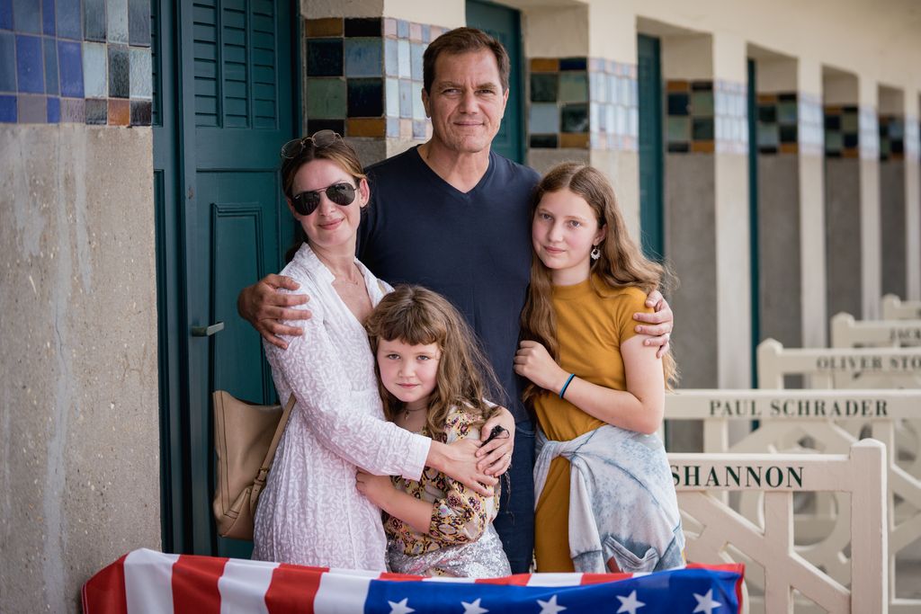 Michael Shannon, Kate Arrington and their children pose during the unveiling of his dedicated beach locker room on the Promenade des Planches during the 47th Deauville American Film Festival on September 11, 2021 in Deauville, France