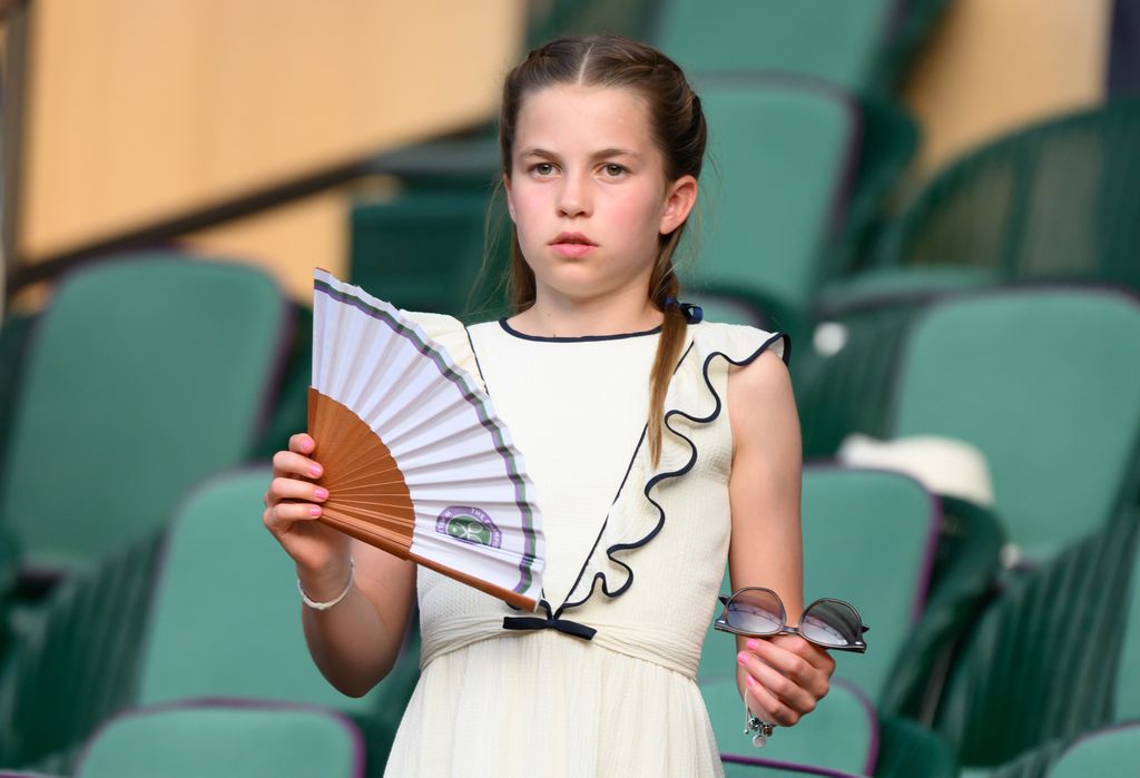 Princess Charlotte in white dress holding fan