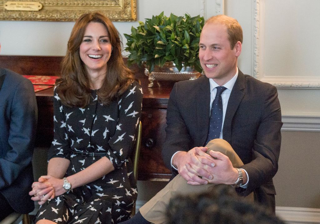 Kate Middleton and Prince William sitting in Kensington Palace