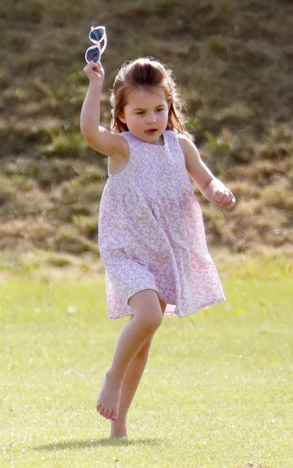 Princess Charlotte running outside barefoot