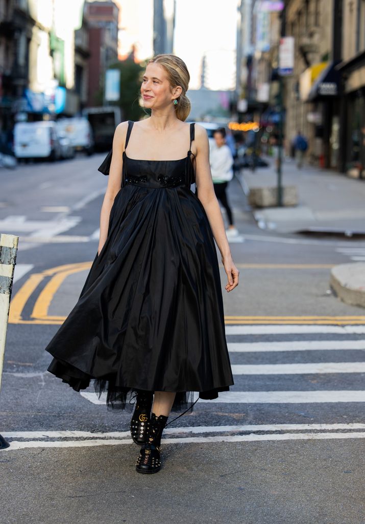 Christine Wuerfel-Stausswears black dress & bag, shoes Meruert Tolegen during New York Fashion Week on September 10, 2024 in New York City