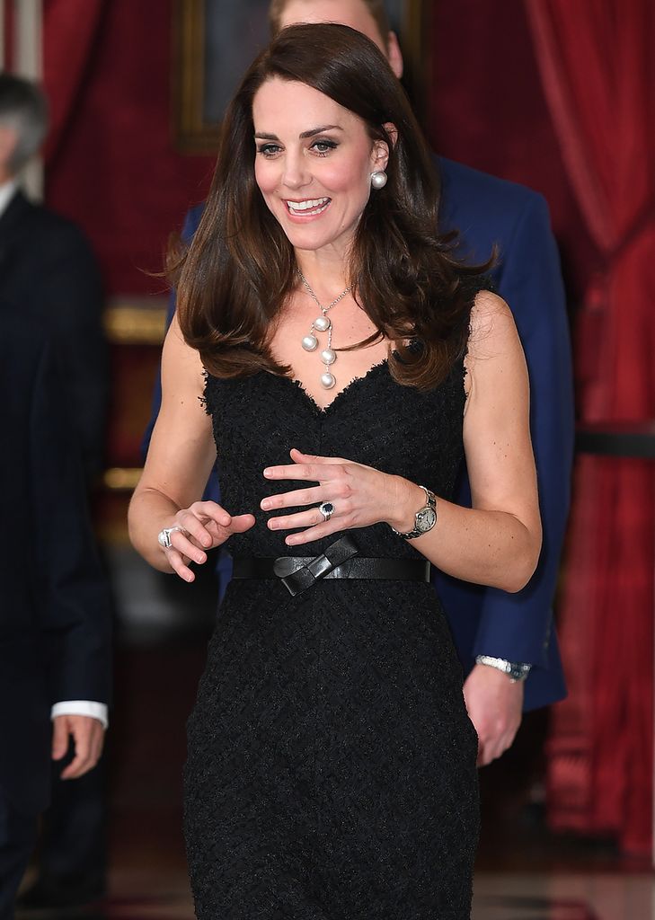 Catherine in black dress talking with her hands