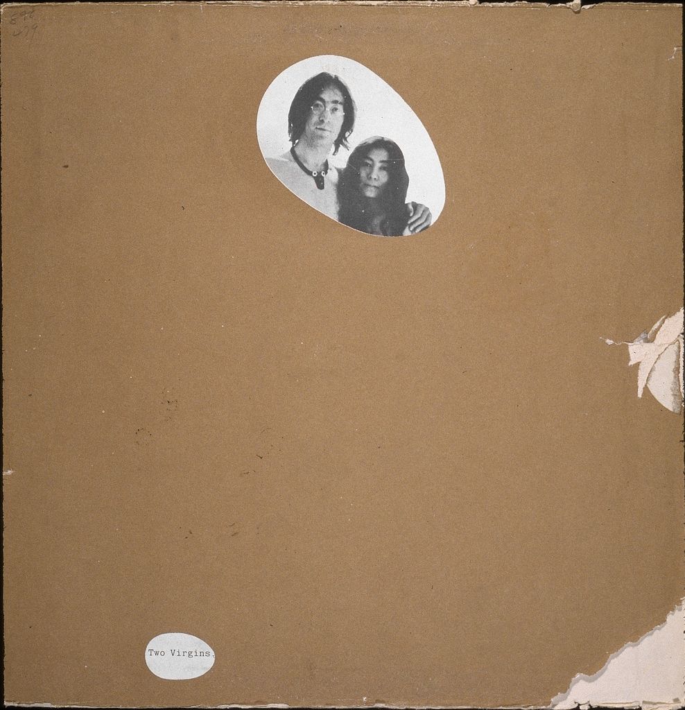 View of a censored version of the front cover of the record album 'Two Virgins,' by British musician John Lennon (1940 - 1980) and Japanese-born musician and artist Yoko Ono, 1968. A plain brown sleeve covers the original art which features the two musicians both completely naked, save for Lennon's glasses and necklace; a pair of cut-outs reveal the album title and the musician's heads. (Photo by Blank Archives/Getty Images)