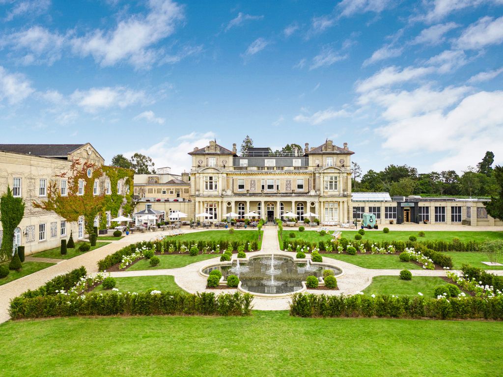 large country manor in Hertfordshire, surrounded by designed gardens and water feature 