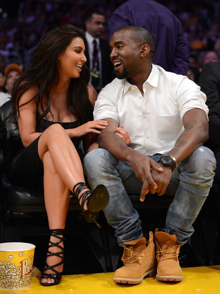 Kim Kardashian and Kanye West at a basketball game