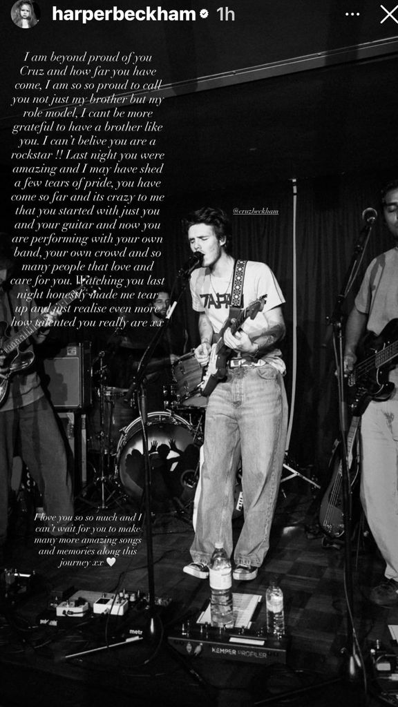 A black and white photo of Cruz Beckham performing on stage