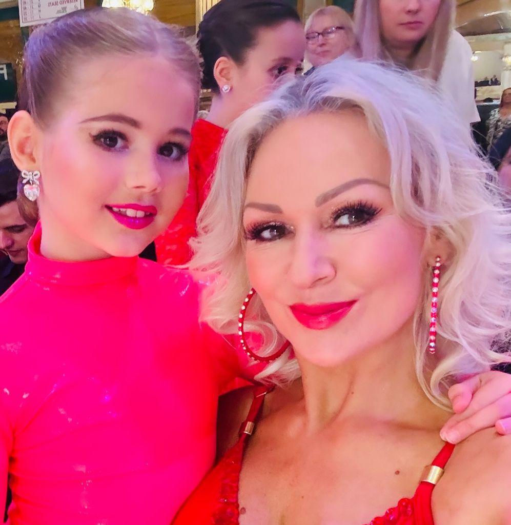 Kristina Rihanoff and daughter Mila in matching red outfits