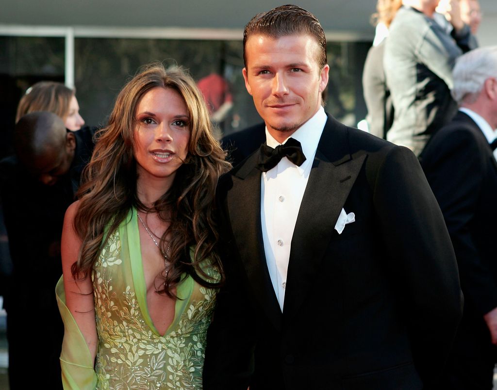 David and Victoria Beckham arrive at the Laureus World Sports Awards on May 16, 2005 at the Estoril Casino, Estoril, Portugal dressed in formal wear smiling for the camera
