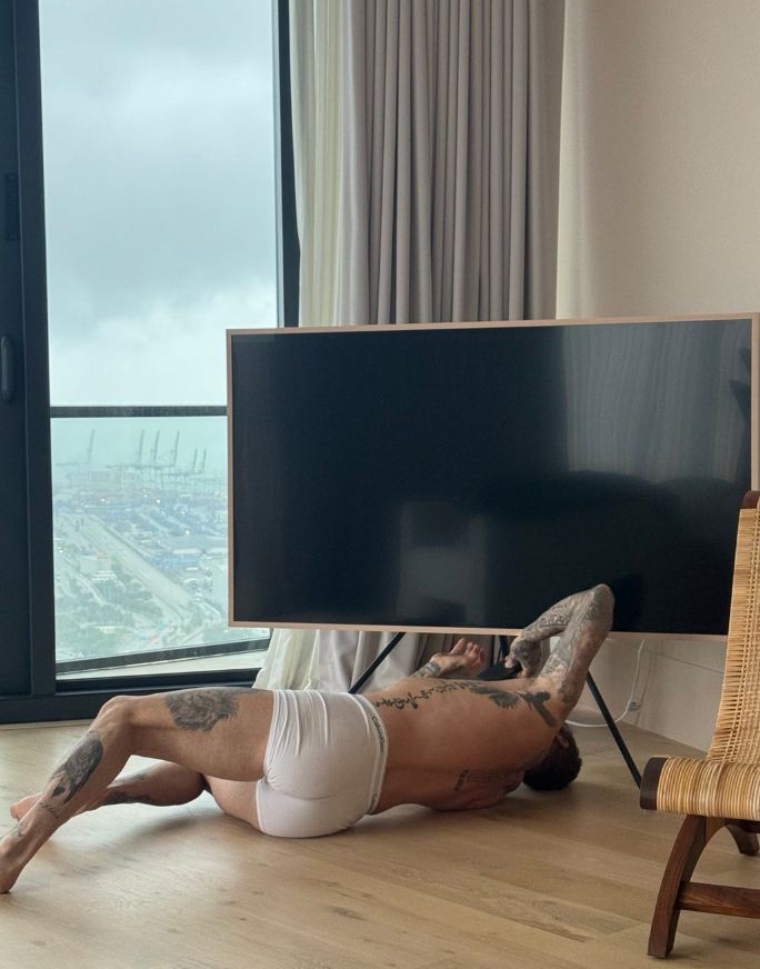 David Beckham in a pair of white boxers underneath a television