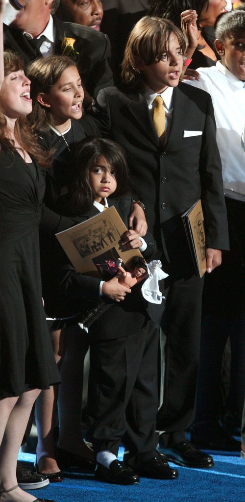 Michael Jackson's children (2L-R) Paris Jackson, Prince 'Blanket'  Jackson II and Prince Michael Jackson stand on stage at the Michael Jackson public memorial service held at Staples Center on July 7, 2009 