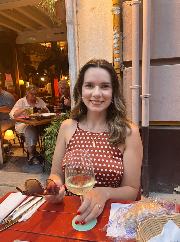 woman with wine at tapas bar