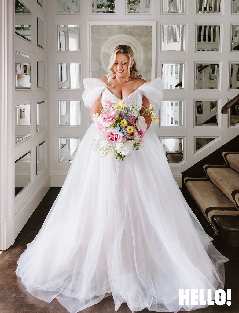 Louise Pentland holding her bridal bouquet 