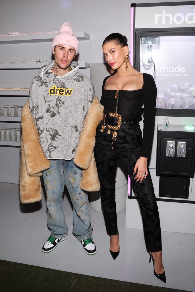 Justin Bieber wears an oversized red coat with wife Hailey in a fur jacket  as they join Tate McRae and Kid LAROI after the NHL All-Star game in  Toronto