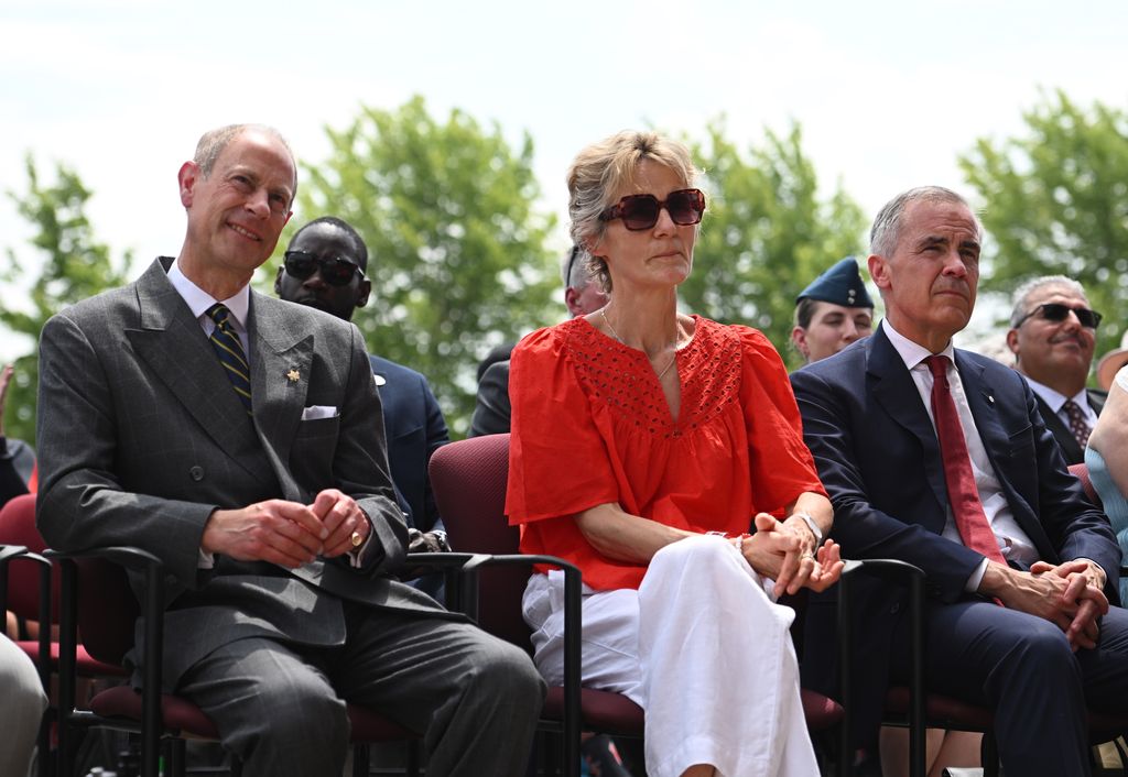 Prince Edward, left to right, Diana Fox Carney and Prime Minister Mark Carney look towards the stage during Canada Day celebrations at LeBreton Flats in Ottawa
