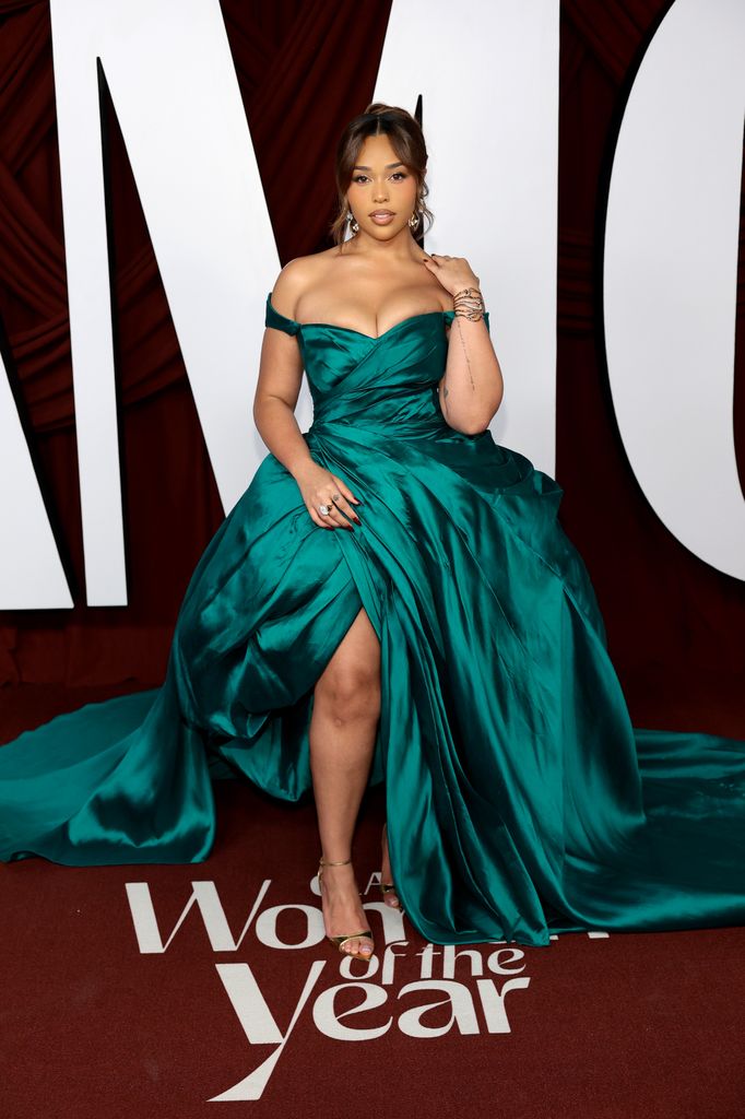 woman in emerald silk dress