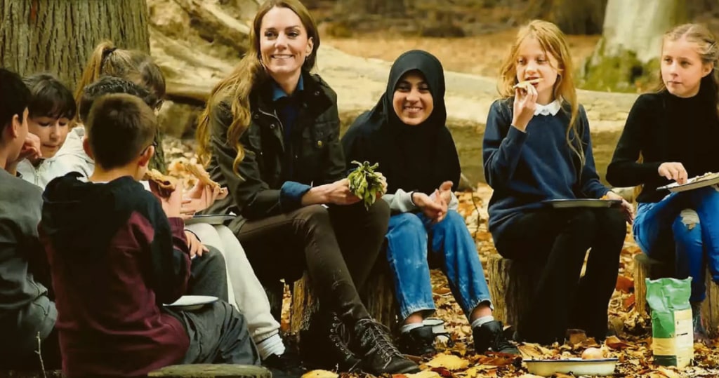 Kate sitting in woodland with children