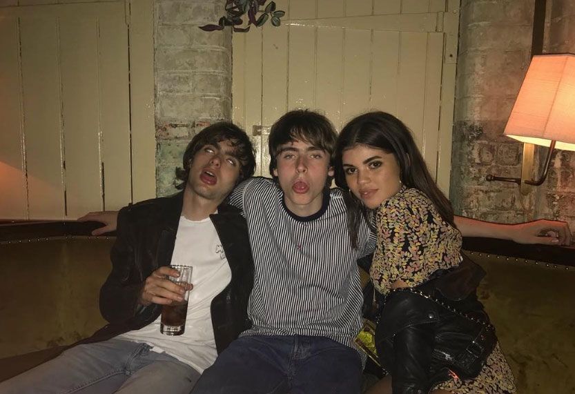 Gene Gallagher, Lennon Gallagher and Molly Morrish-Gallagher pose together on a sofa