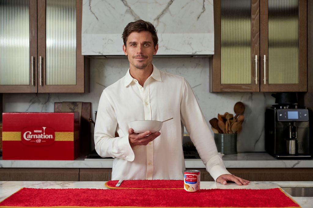 Antoni Porowski poses with Carnation milk