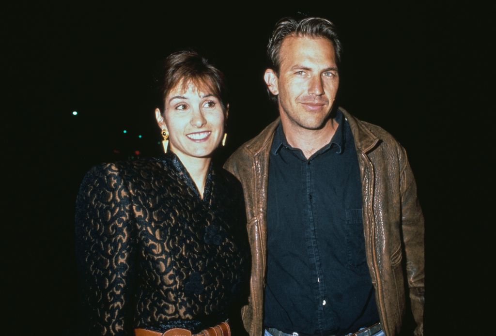 American actor and film director Kevin Costner, wearing a brown leather jacket over a black shirt, with his wife, Cindy Silva, who wears a black-and-bronze outfit with sunglasses, United States, circa 1990. (Photo by Vinnie Zuffante/Getty Images)