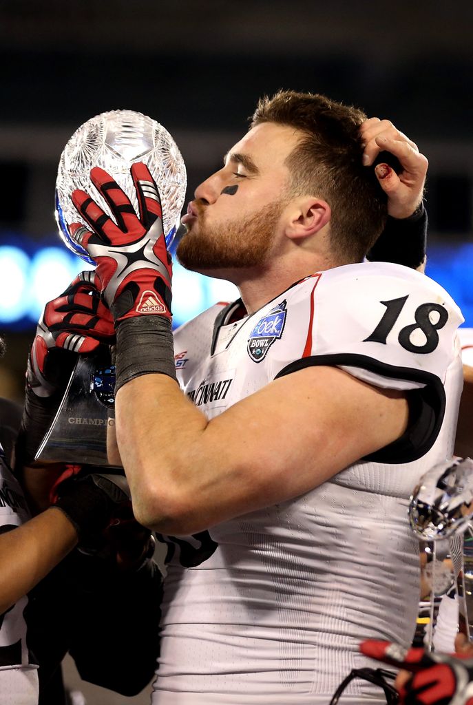 Travis Kelce #18 of the Cincinnati Bearcats celebrates with the trophy after catching the game winning touchdown in 2012