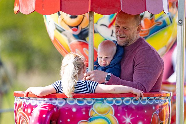 Mike Tindall with his children inside a spinning cup during the summer