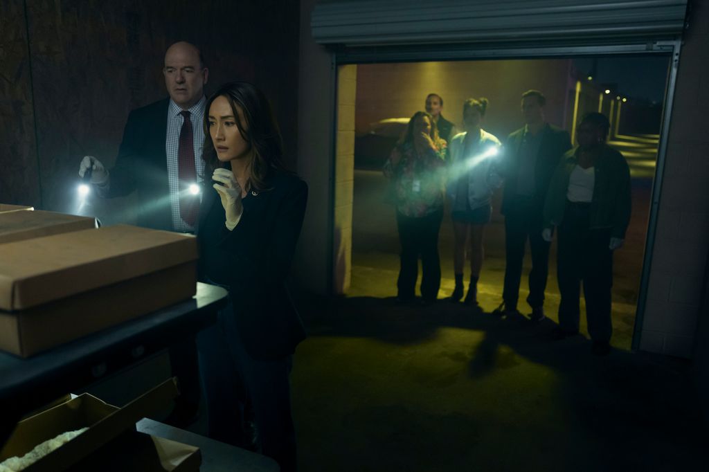 John Carroll Lynch (Thomas Laffont) and Maggie Q (Renee Ballard) in a still from Ballard