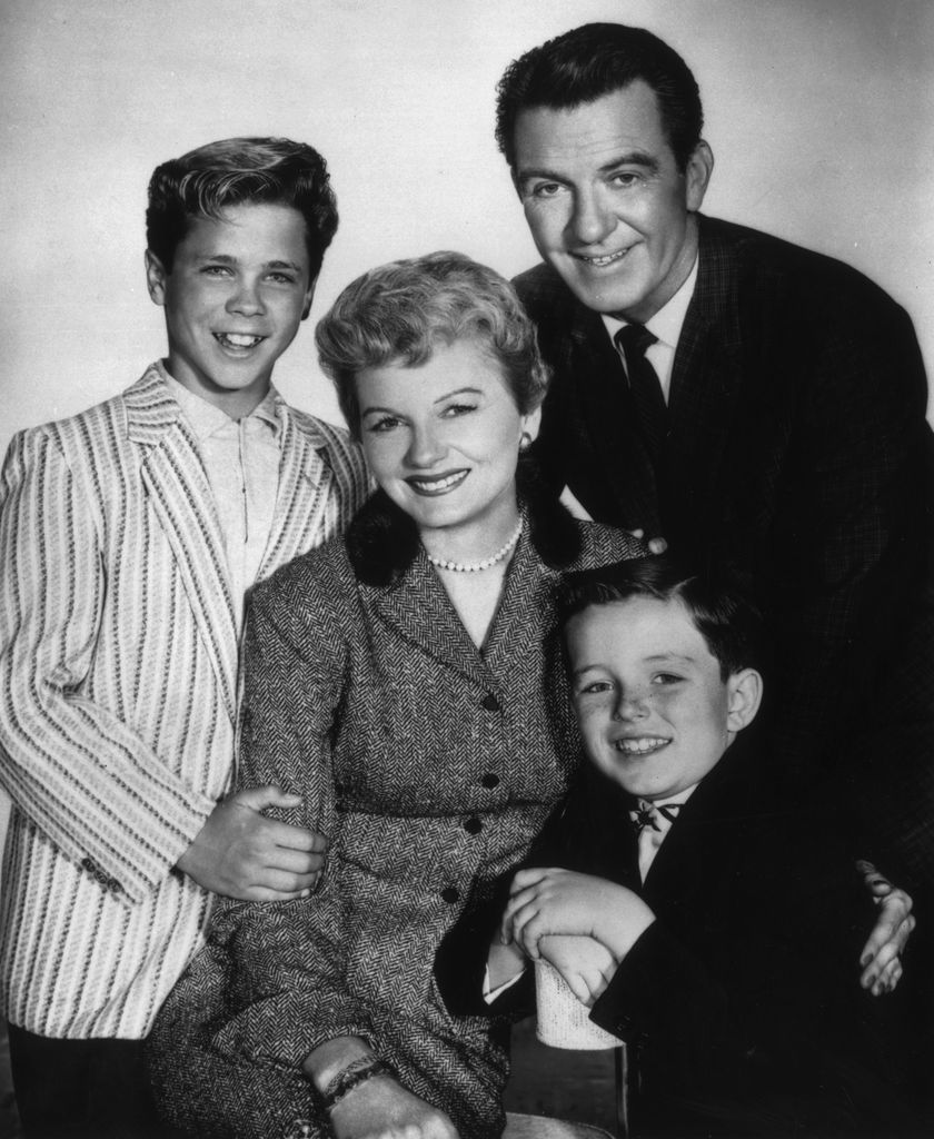 circa 1957:  American actors (clockwise, from left) Tony Dow, Hugh Beaumont (1909 - 1982), Jerry Mathers, and Barbara Billingsley pose together in a promotional portrait for the television series, 'Leave It to Beaver'