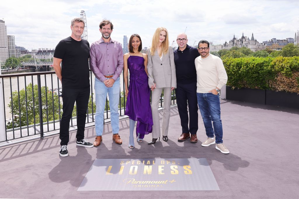 Zoe Saldana and Nicole Kidman stood with a group of four men