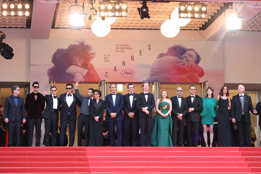 Roman Coppola, Richard Ayoade, Michael Cera, Benicio del Toro, Riz Ahmed, Rachida Dati, Alexandre Desplat, Rupert Friend, Wes Anderson, Mia Threapleton, Jeffrey Wright, Benedict Cumberbatch, Charlotte Gainsbourg, Antonia Desplat and Bill Murray attend the "The Phoenician Scheme" red carpet at the 78th annual Cannes Film Festival at Palais des Festivals on May 18, 2025 in Cannes, France.