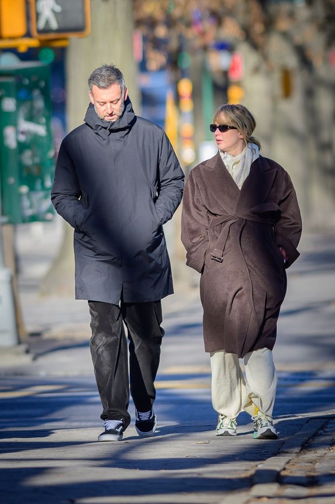 The couple enjoyed a leisurely walk in a park after errands