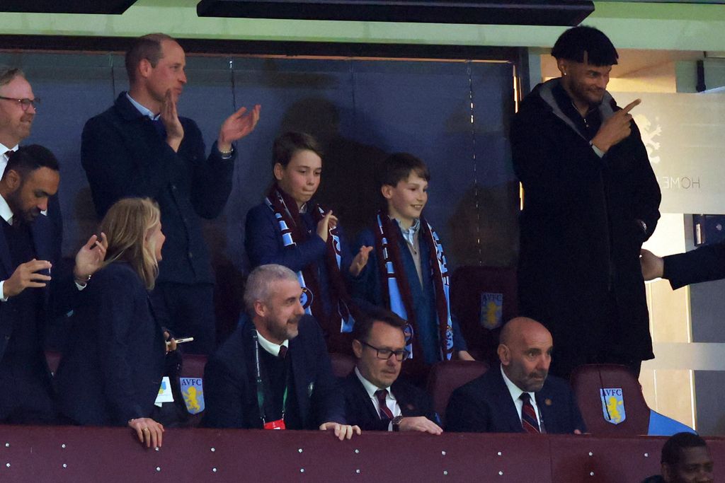 Prince William, Prince of Wales and Prince George of Wales look on alongside Tyrone Mings of Aston Villa during the UEFA Europa Conference League 2023/24 Quarter-final