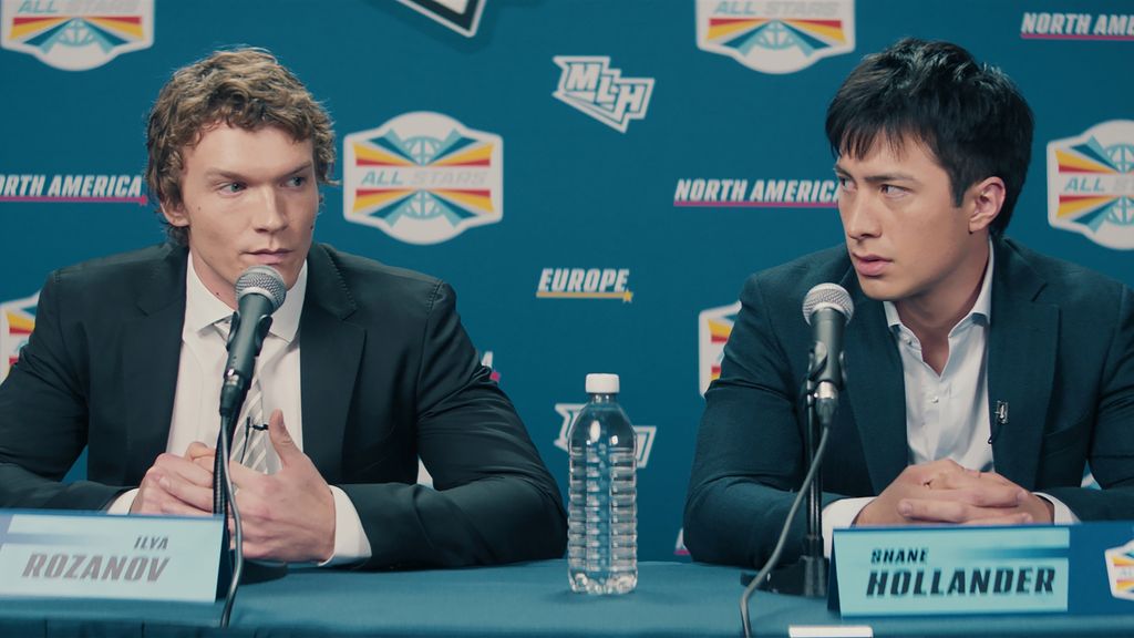 Connor Storrie and Hudson Williams sat at a press conference in Heated Rivalry