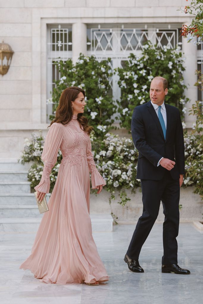 Prince William looked dapper in a navy blue suit
