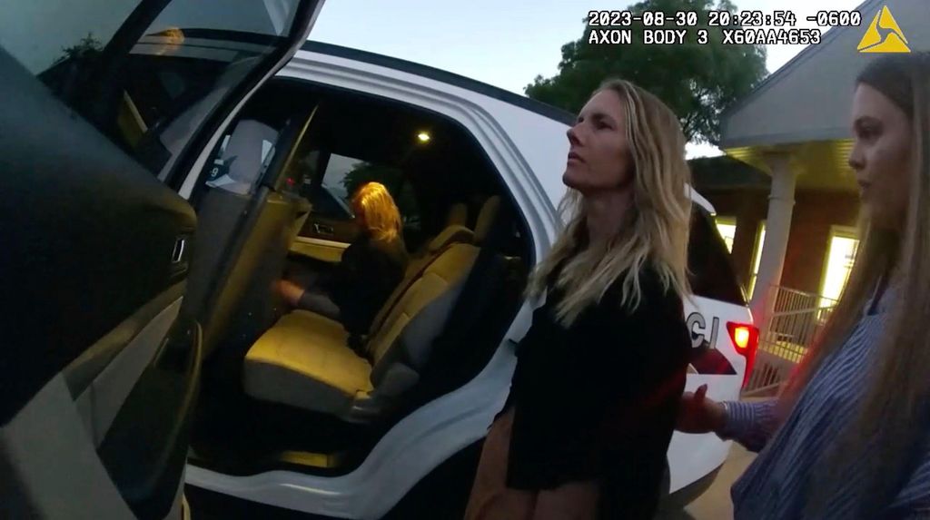 This image taken from body camera footage provided by Washington County Attorney's Office shows Jodi Hildebrandt, left, and Ruby Franke, center, being arrested on child abuse charges on Aug. 30, 2023, in Ivins, Utah. 