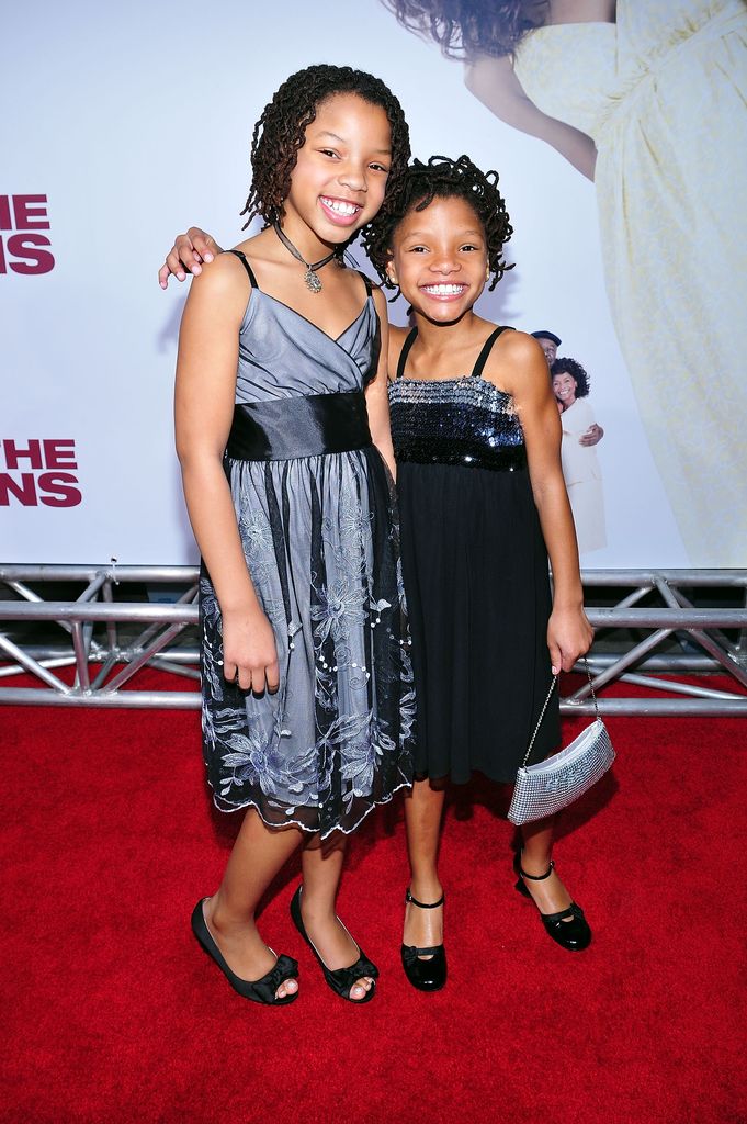 Actress Chloe Bailey (left) poses with sister, actress Halle Bailey, on the red carpet at the premiere "meet brown" March 13, 2008 at the Cinerama Dome Theater in Los Angeles, California