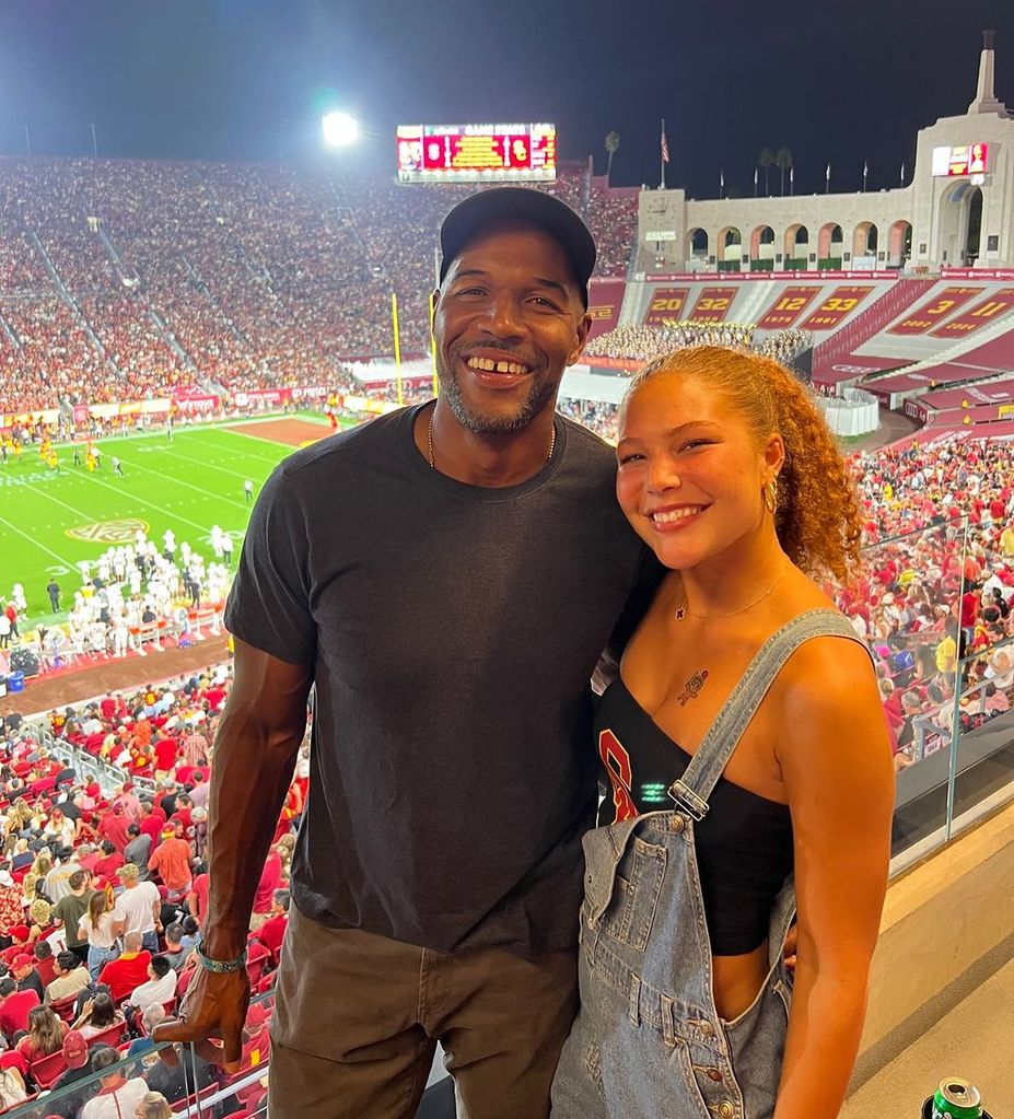 Michael Strahan with daughter Isabella Strahan at USC game