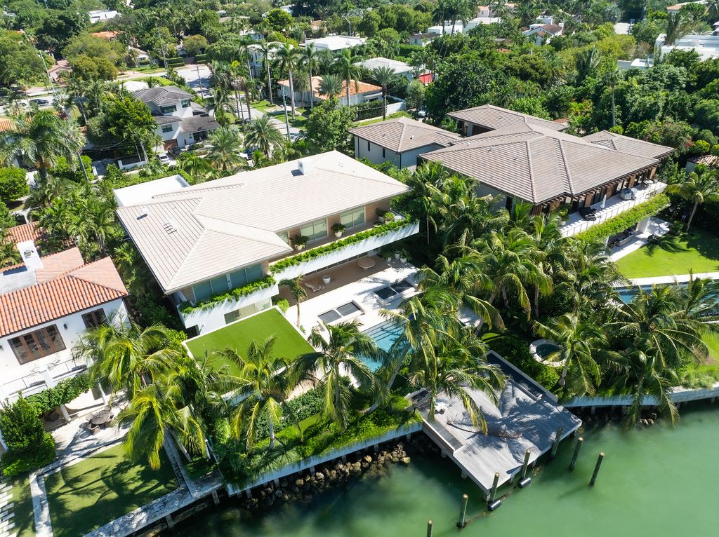 View of Cindy Crawford's Miami Beach home, revealing a swimming pool, and dock