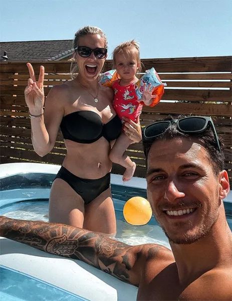 gemma atkinson in pool with daughter and gorka marquez smiling