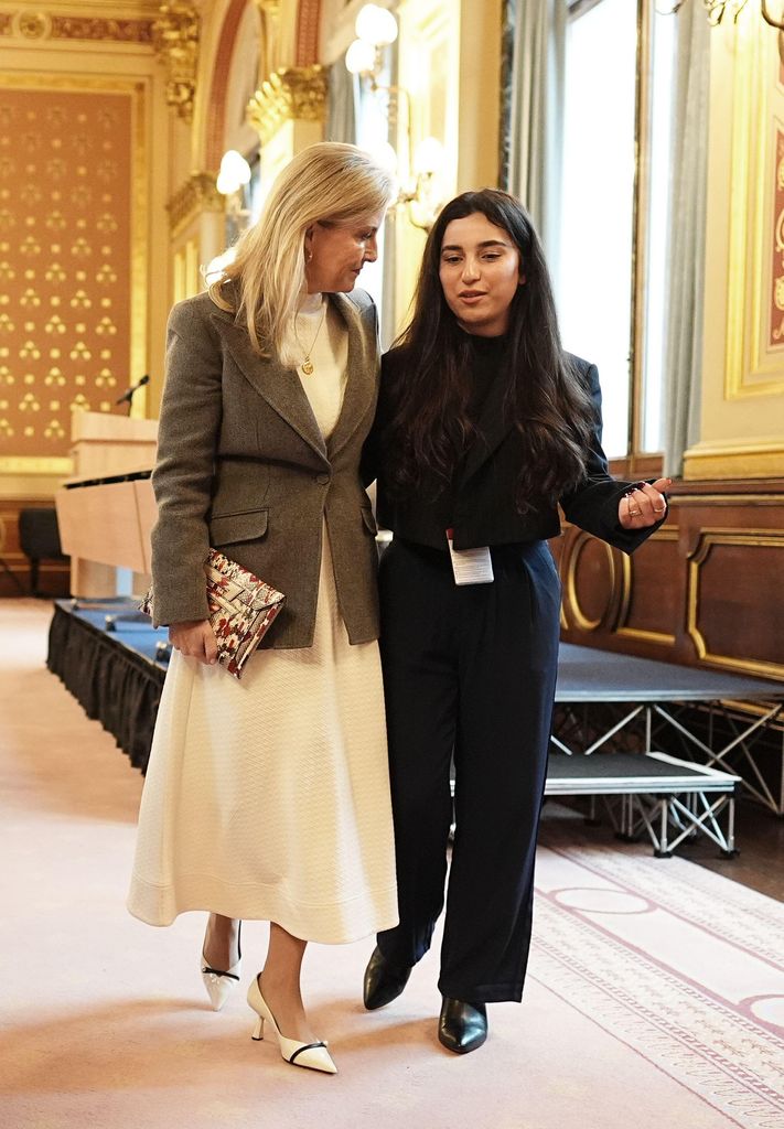 The Duchess of Edinburgh (left) speaking to Yazidi survivor Awaz Abdi