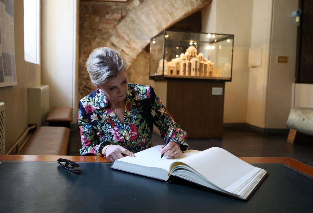 Britain's Sophie, Duchess of Edinburgh, signs the guestbook as she visits the Saint Sophia Cathedral in Kyiv