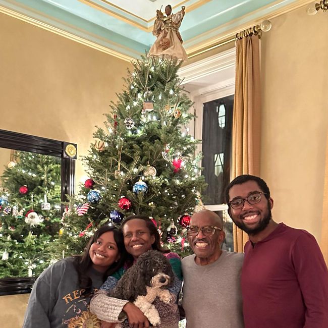 Al Roker with his kids, wife and dog in front of a christmas tree