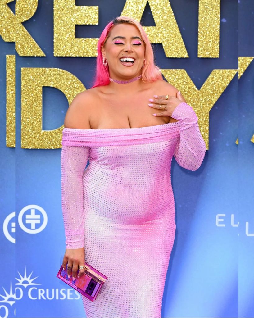 Megan in a pink dress on the red carpet