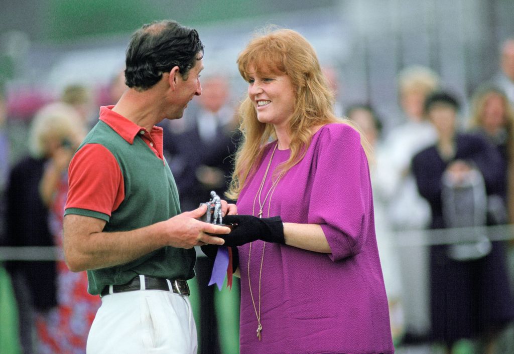 sarah presenting charles with a prize 