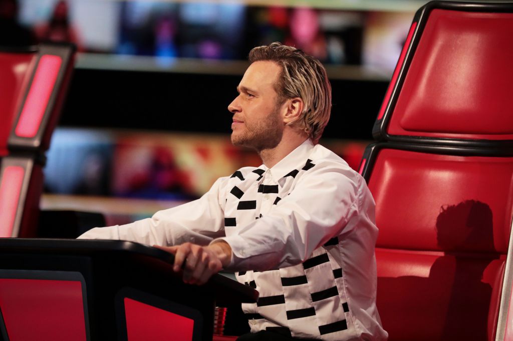 Olly Murs sitting in a red chair