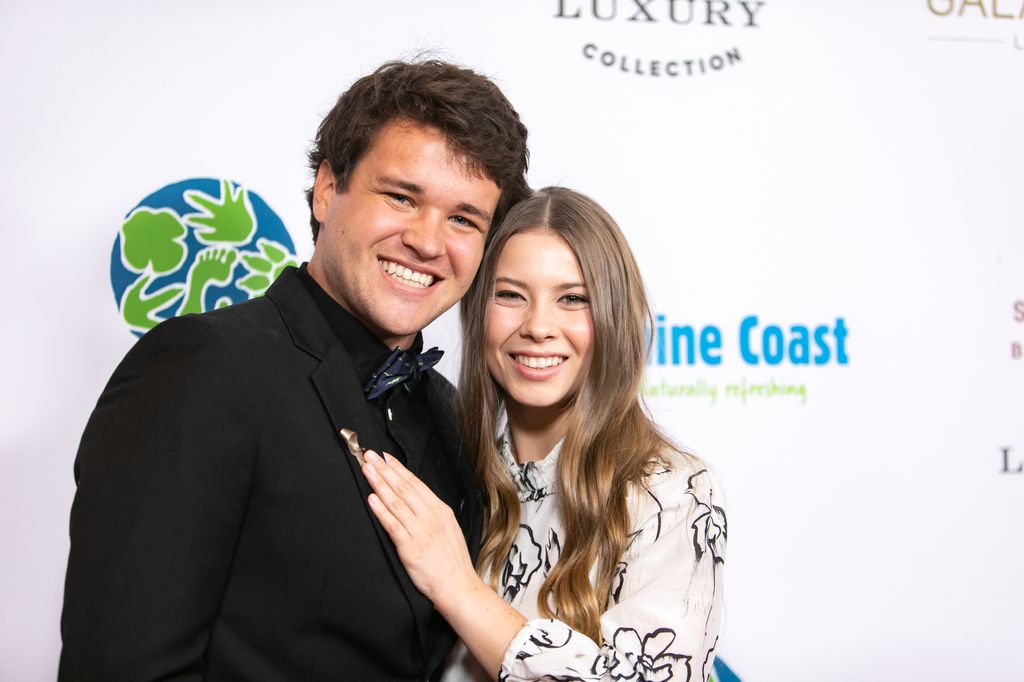 Bindi Irwin cuddles up to her husband Chandler Powell and puts a tender hand on his chest